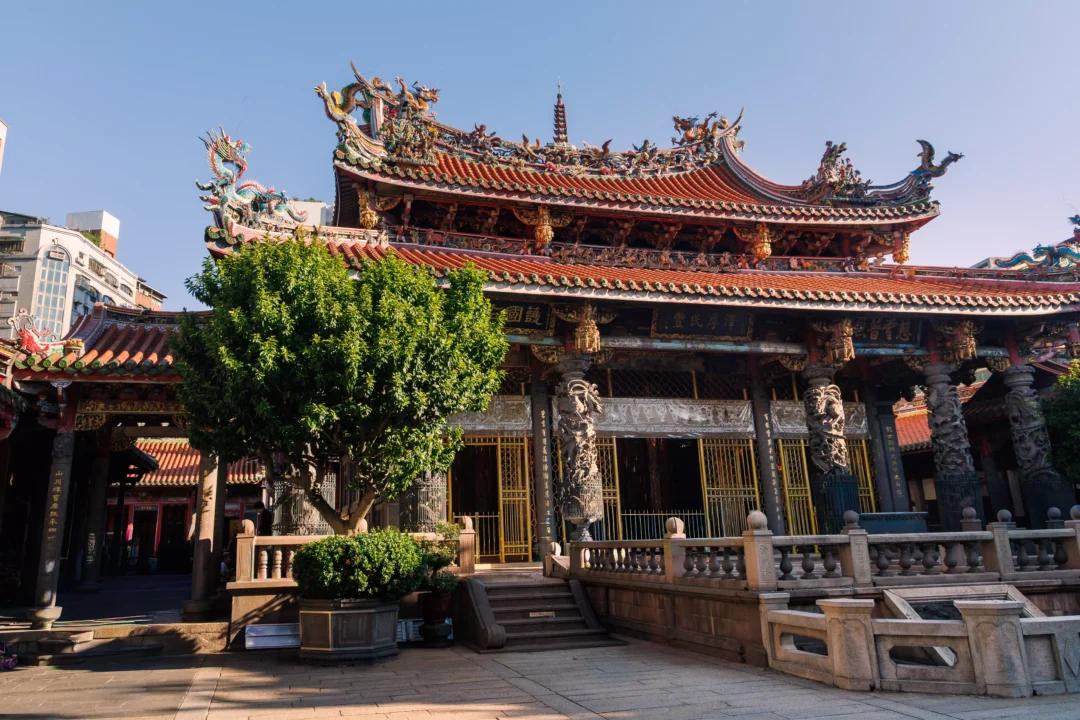 Quiet morning exterior view of Longshan Temple courtyard with soft early light