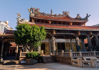 Quiet morning exterior view of Longshan Temple courtyard with soft early light