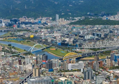 Aerial view of Taipei's rivers and coloured arch bridges from Taipei 101