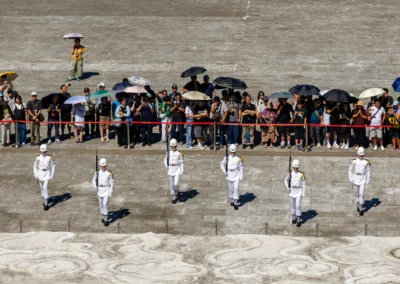 Six military honour guards in white uniforms in formation on the steps of Chiang Kai-shek Memorial Hall during guard ceremony