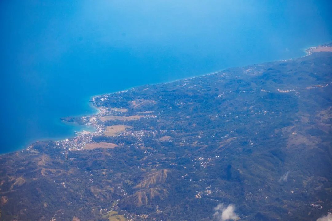 Aerial coastline blue sea green mountains cebu