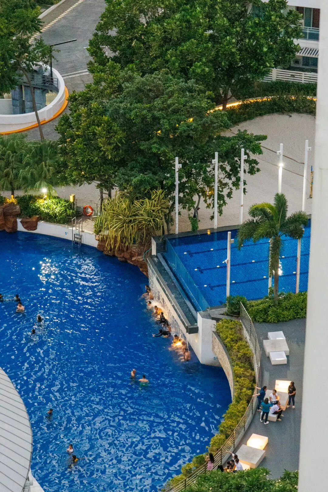 Aerial resort lagoon dusk swimmers manila