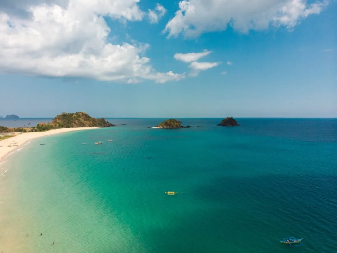 Aerial scattered islets turquoise bay El Nido