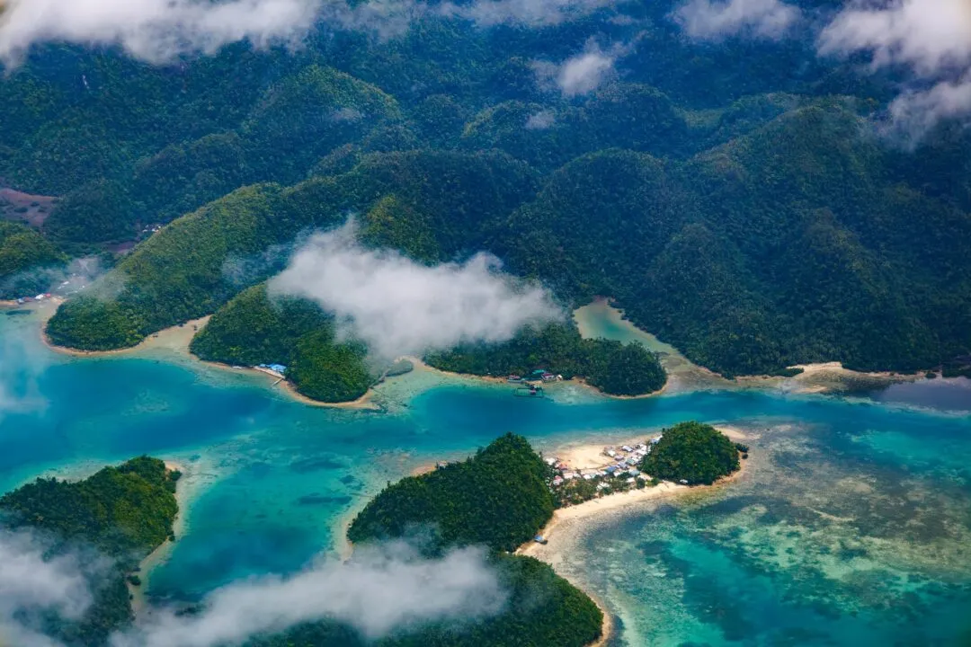 Aerial turquoise lagoons forested islets siargao