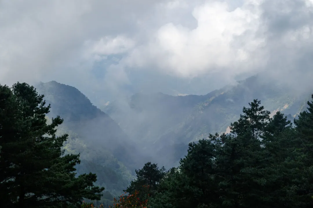 Dramatic clouds parting over ridgelines, Alishan, Taiwan