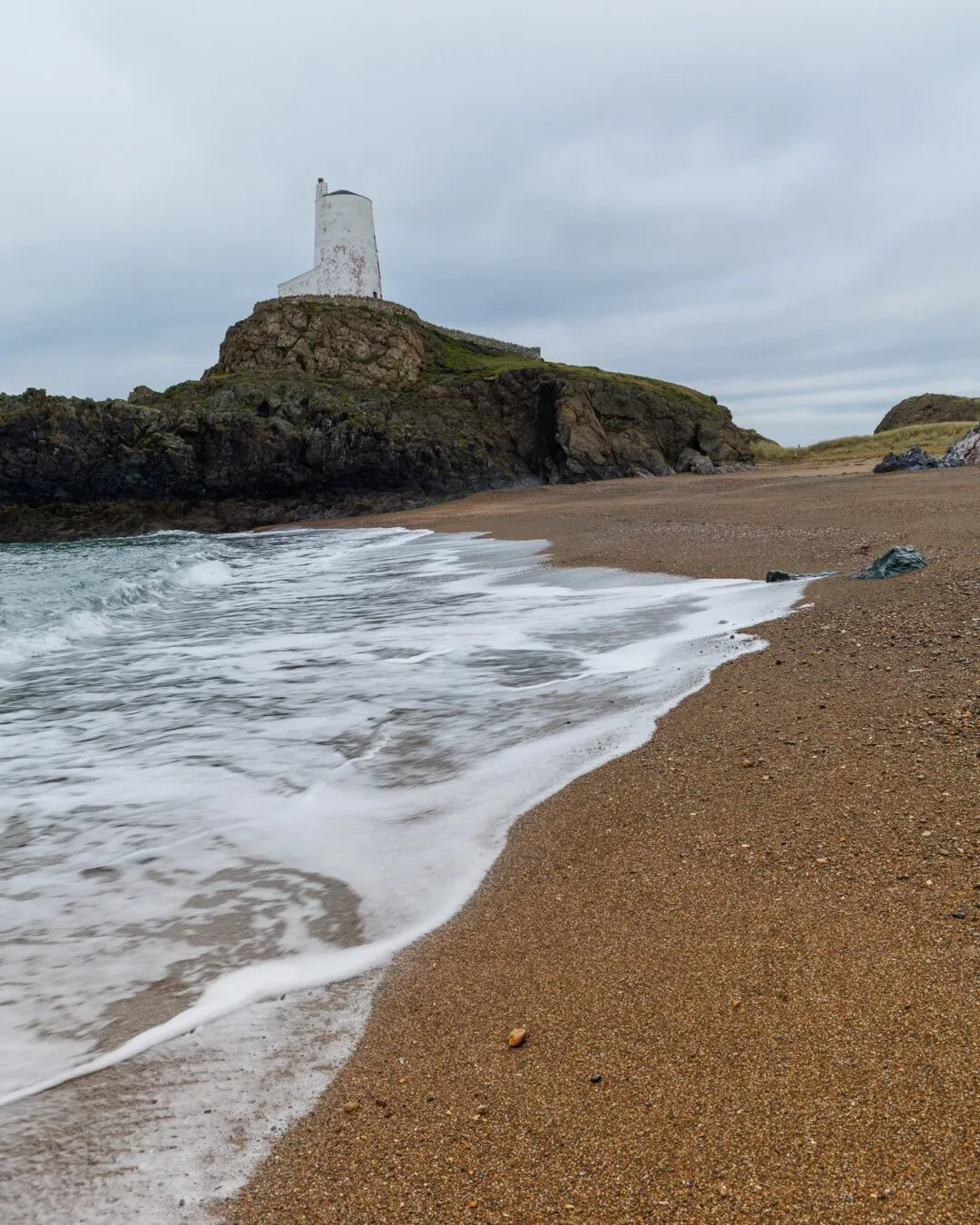 Anglesey llanddwyn lighthouse wave