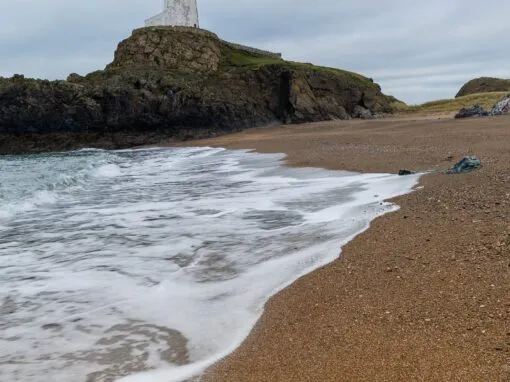 Anglesey llanddwyn lighthouse wave