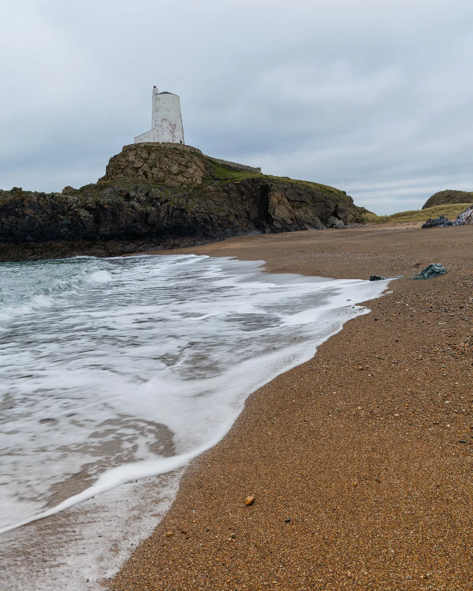 Anglesey Llanddwyn Lighthouse Wave Anglesey llanddwyn lighthouse wave