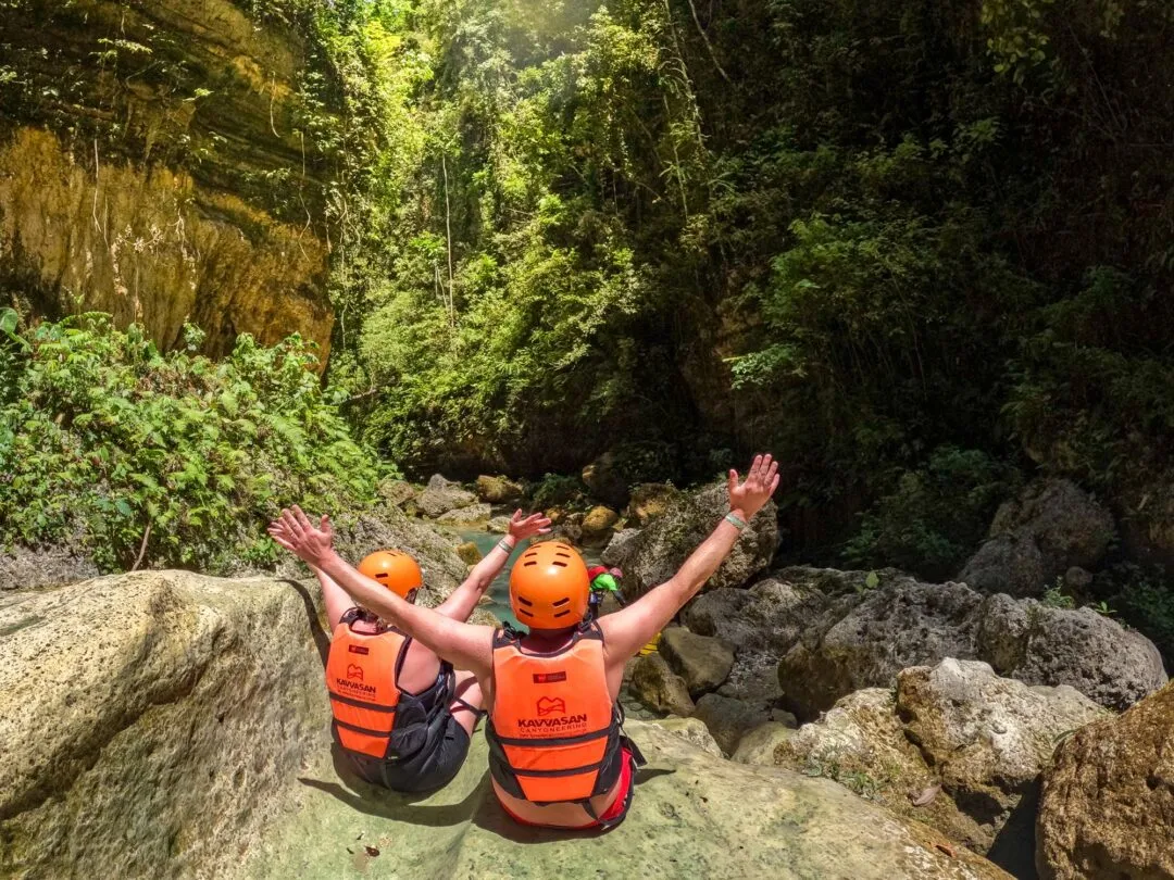 Arms raised celebrating canyon view cebu