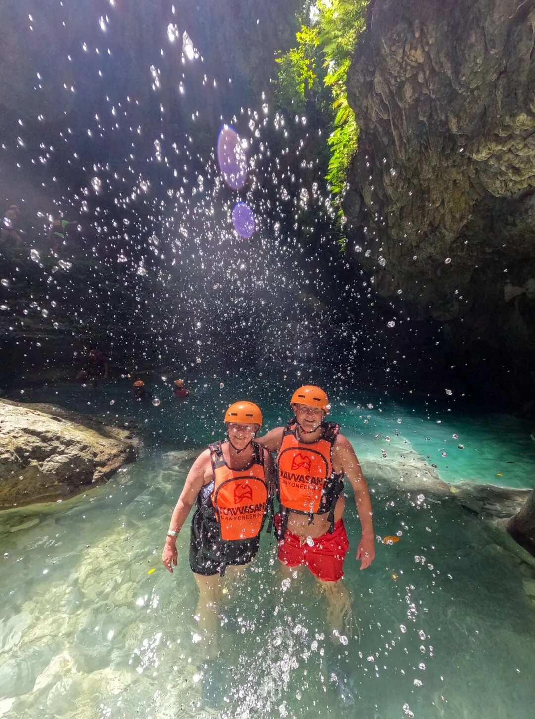Backlit water droplets couple canyon cebu