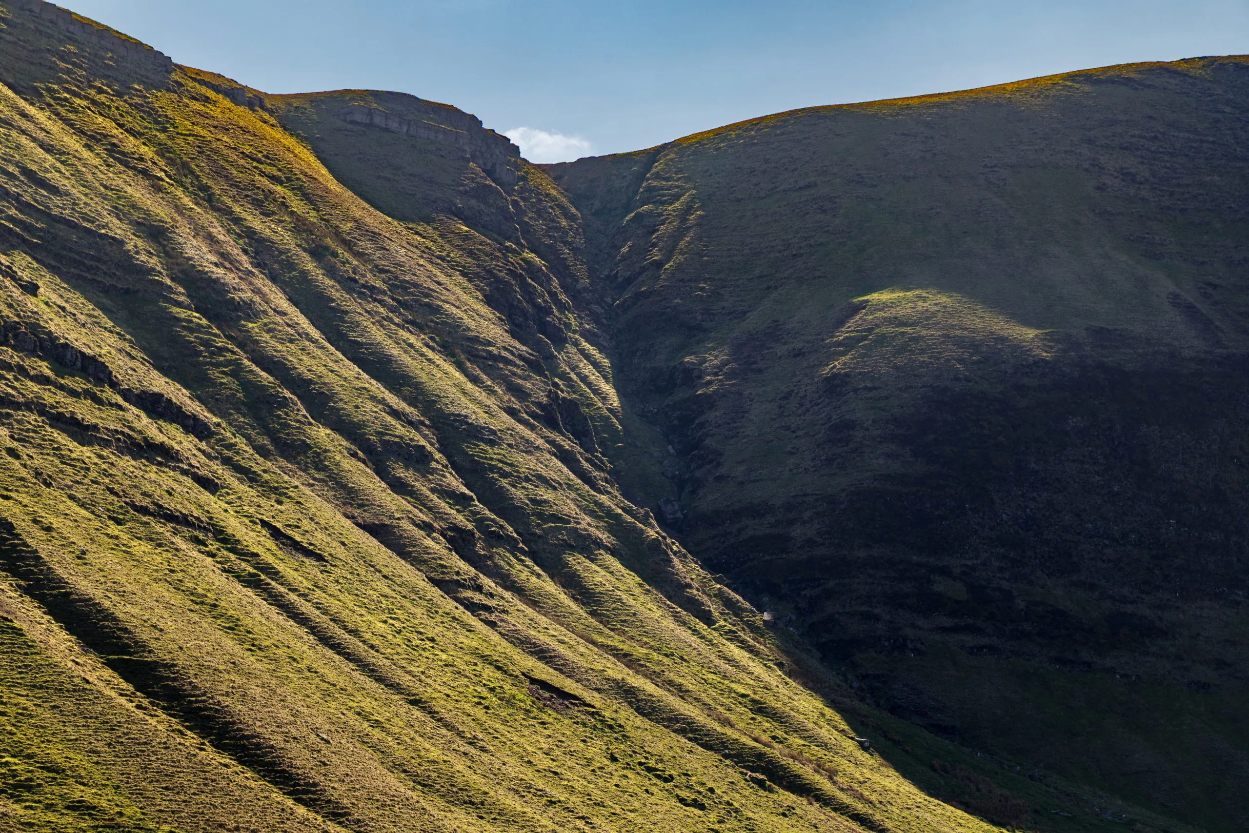 Abstract raking light mountain slopes, the Brecon Beacons, Wales