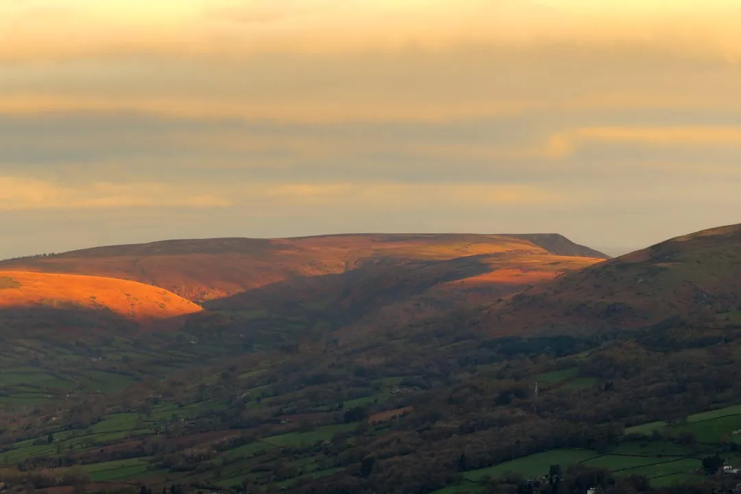 Dramatic orange ridgeline sunset, the Brecon Beacons, Wales