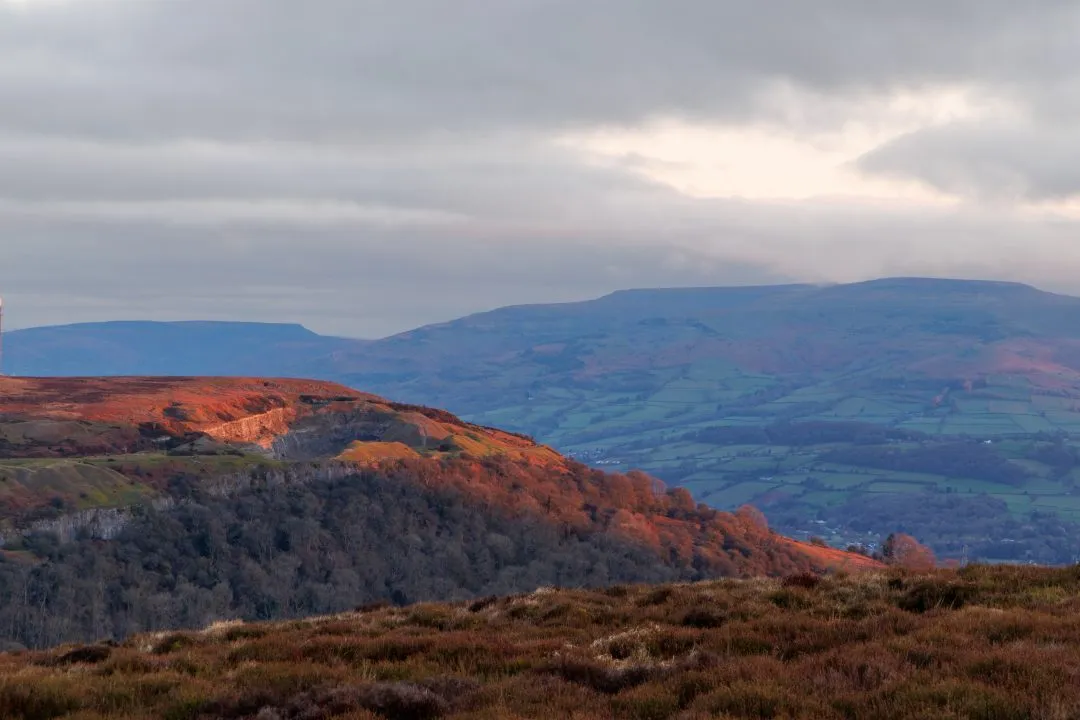 Red lit hillside quarry valley, the Brecon Beacons, Wales