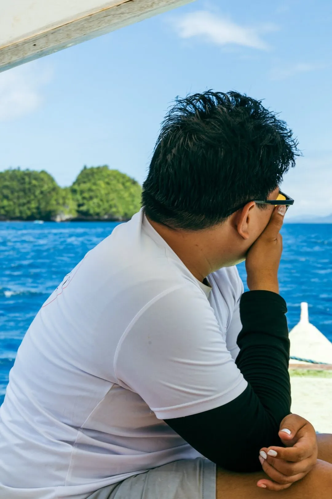 Candid man gazing distant islands siargao