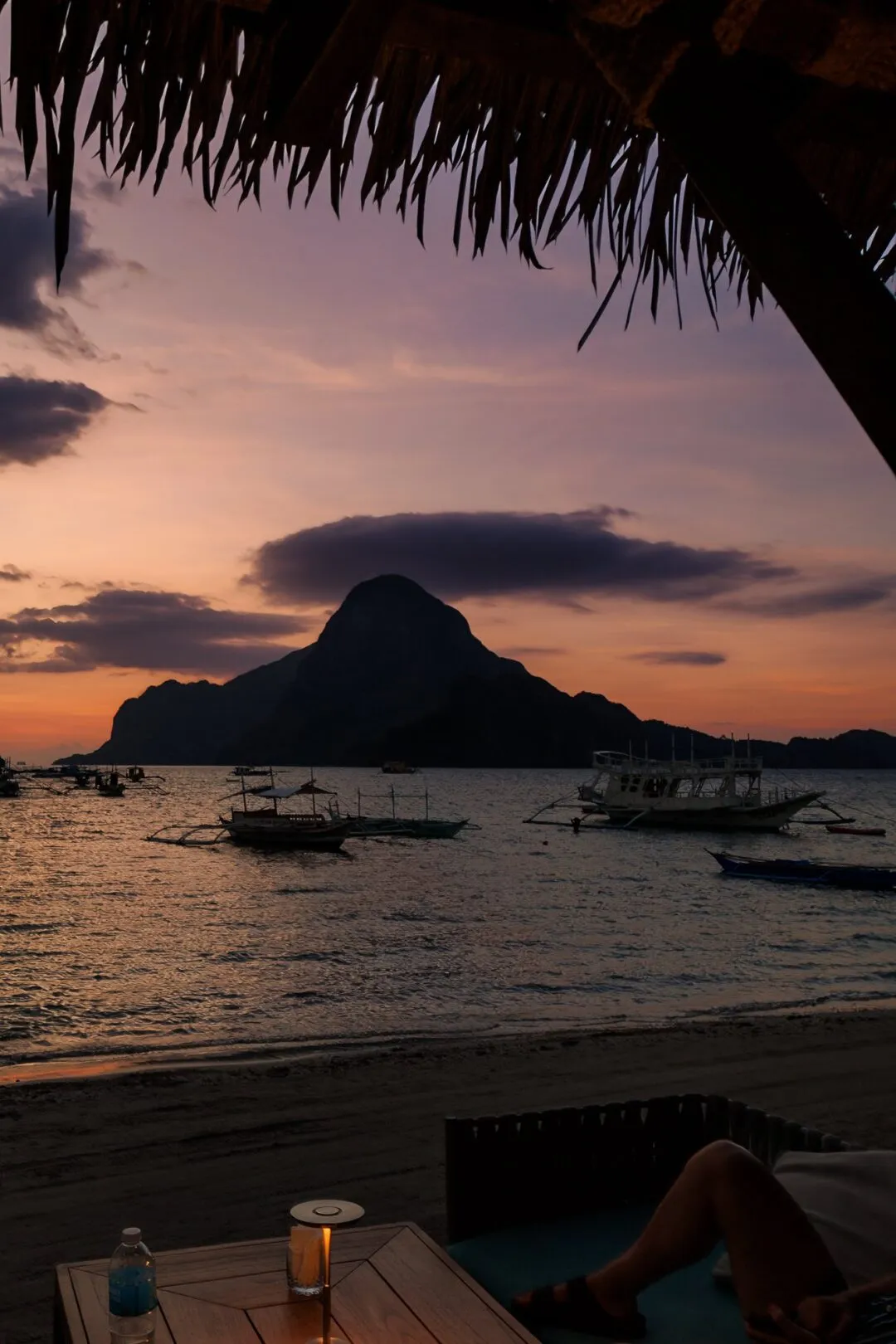 Candlelit dinner sunset island silhouette El Nido