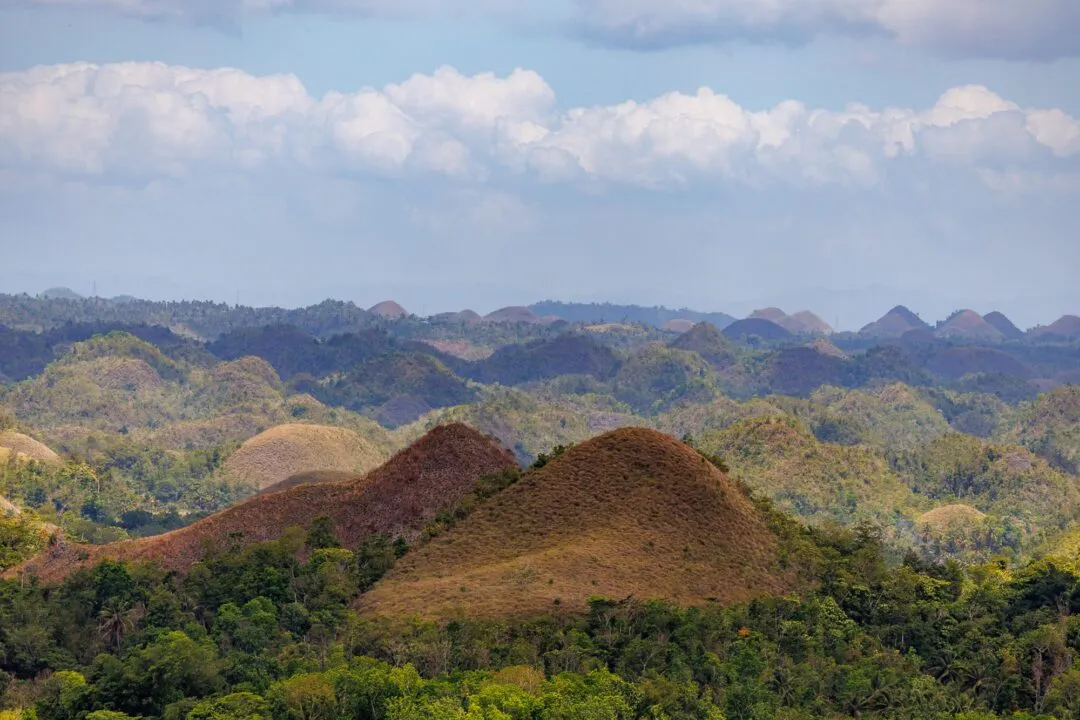Conical hills close framing clouds bohol