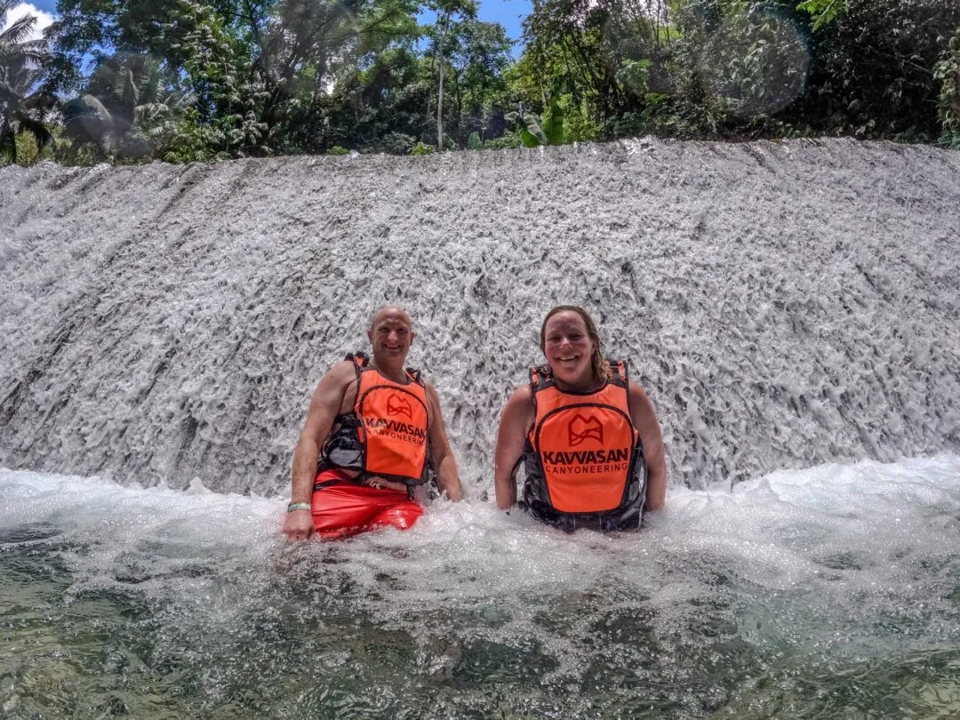 Couple laughing waterfall spray cebu