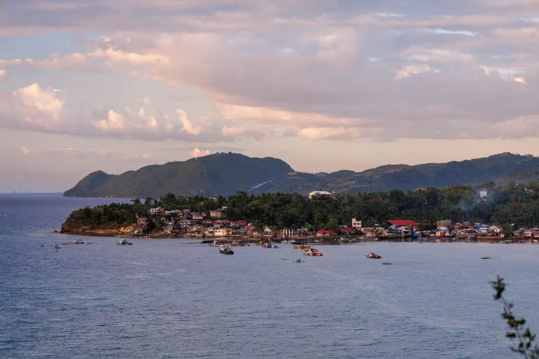 Dusk coastal fishing village boats cebu