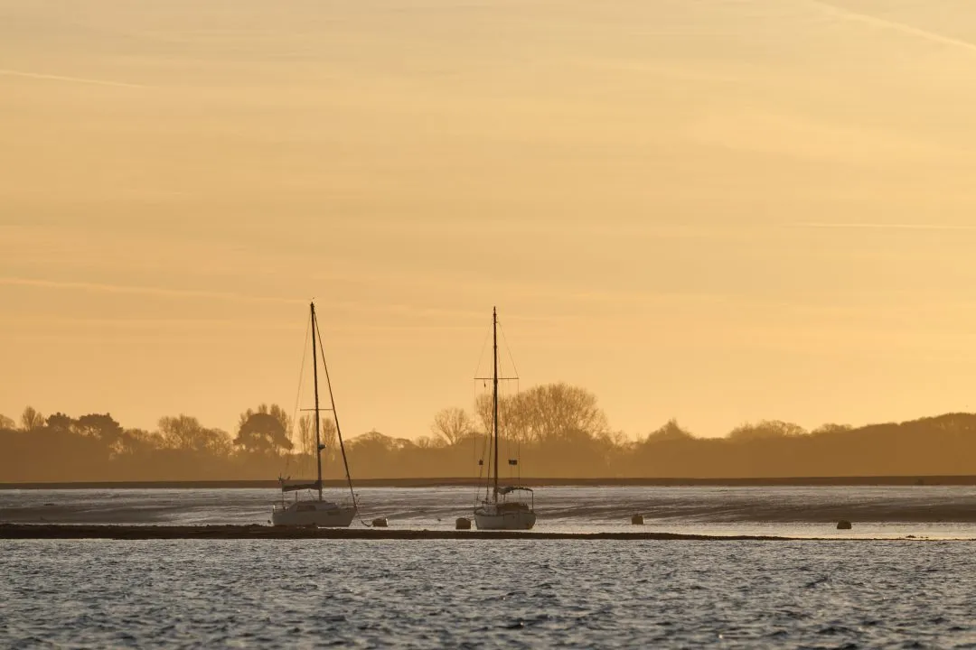 Grounded sailboats silhouette, Eastney