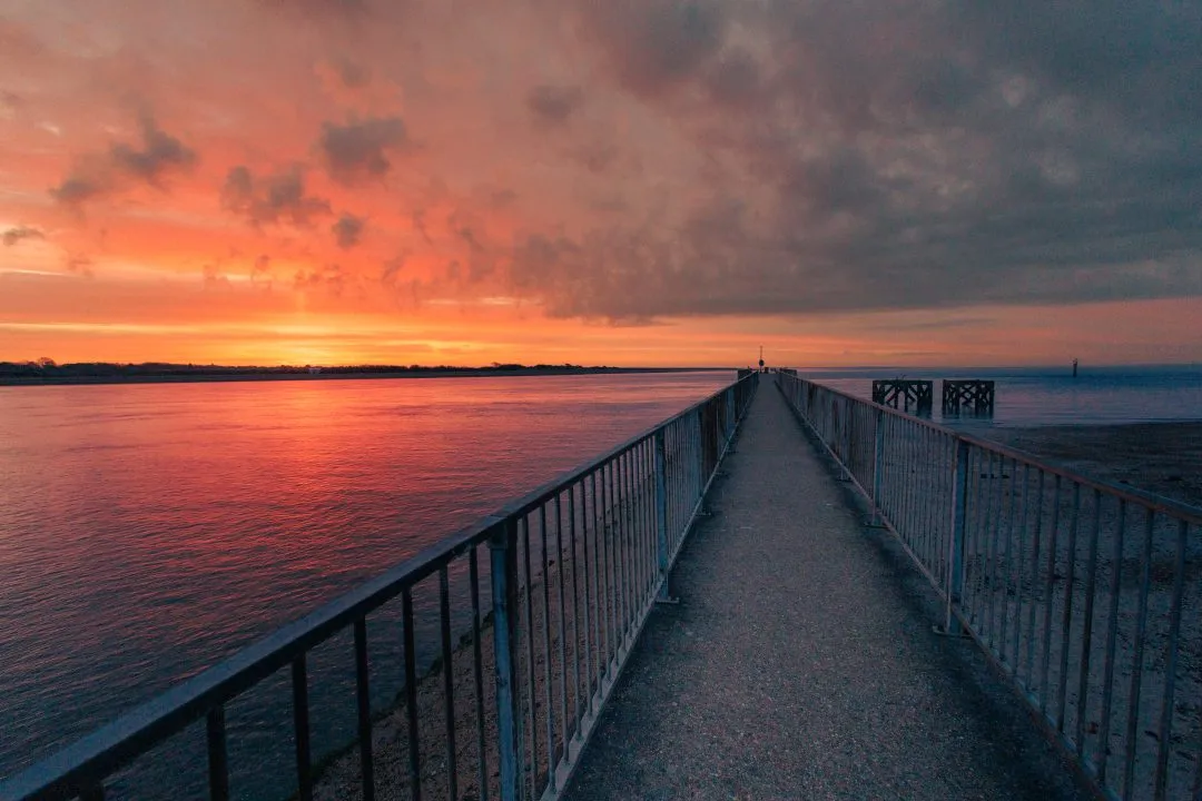 Pier railing fiery sunset, Eastney