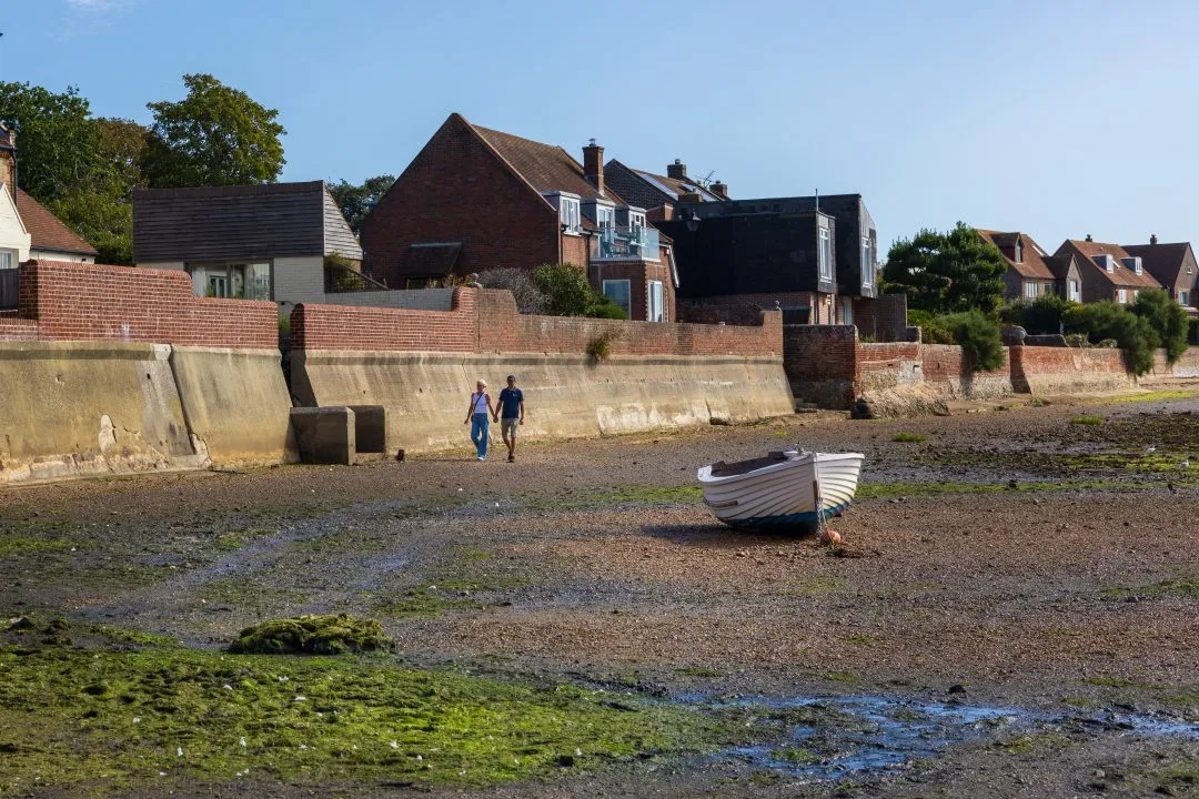 Beached boat couple walking, Emsworth