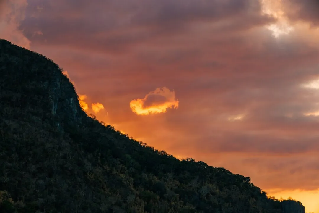 Fiery sunset cloudscape karst ridge El Nido