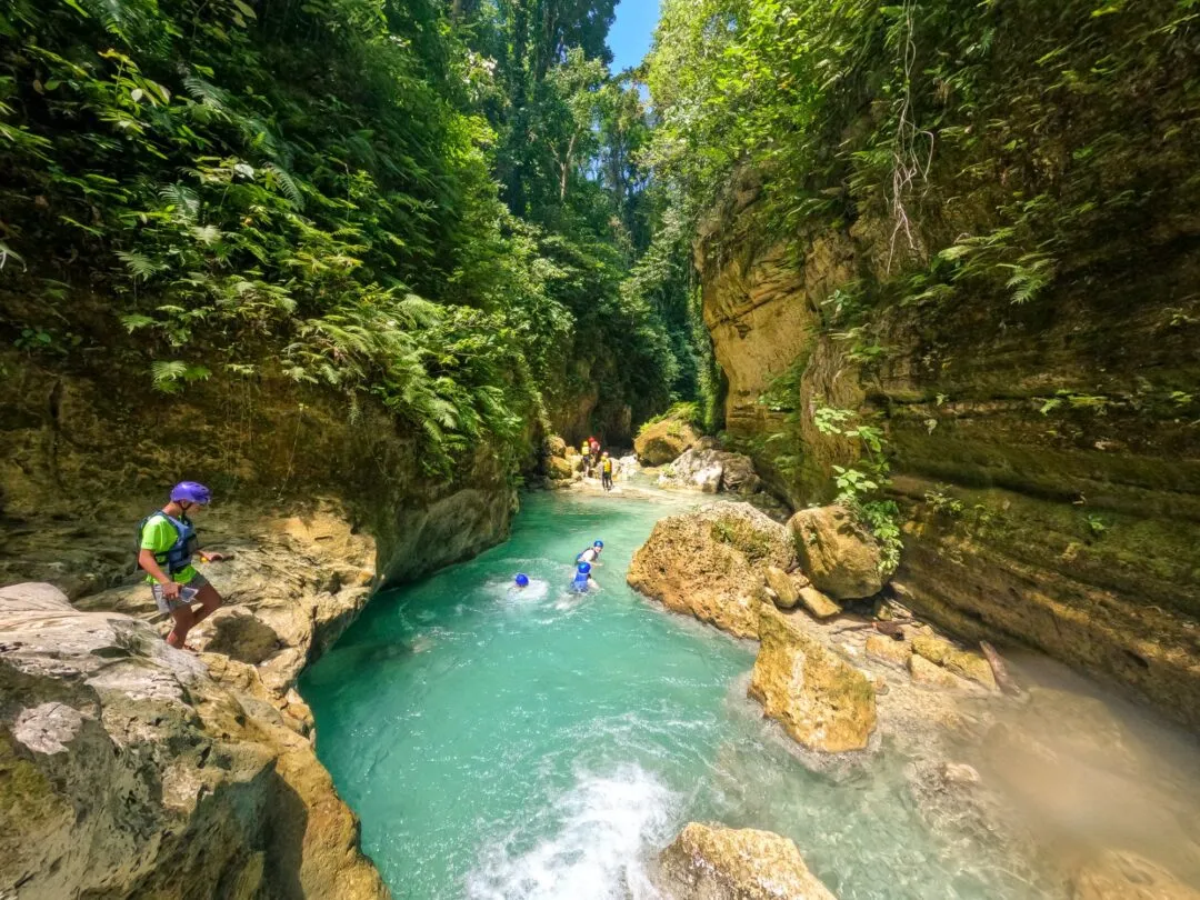 Guide navigating canyon rocks cebu