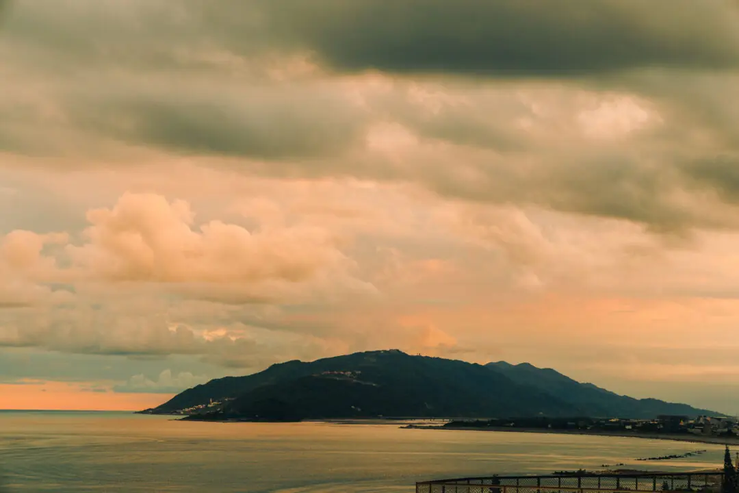 Layered mountain and coastline silhouette at sunset near Hualien, Taiwan