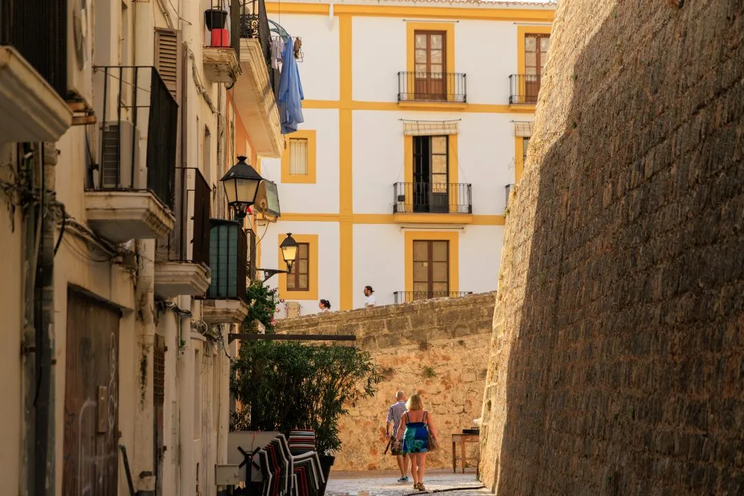 Fortress walkway lamp posts visitor, Ibiza Old Town