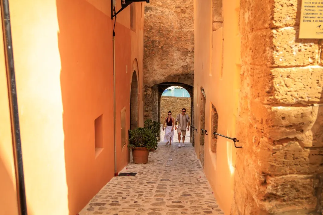 Orange alley couple harbour view, Ibiza Old Town