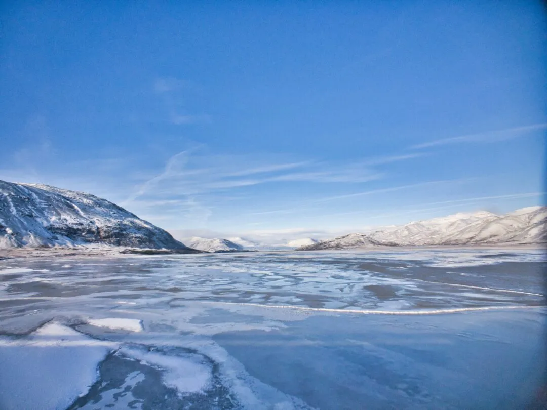 Iceland frozen fjord snow capped mountains