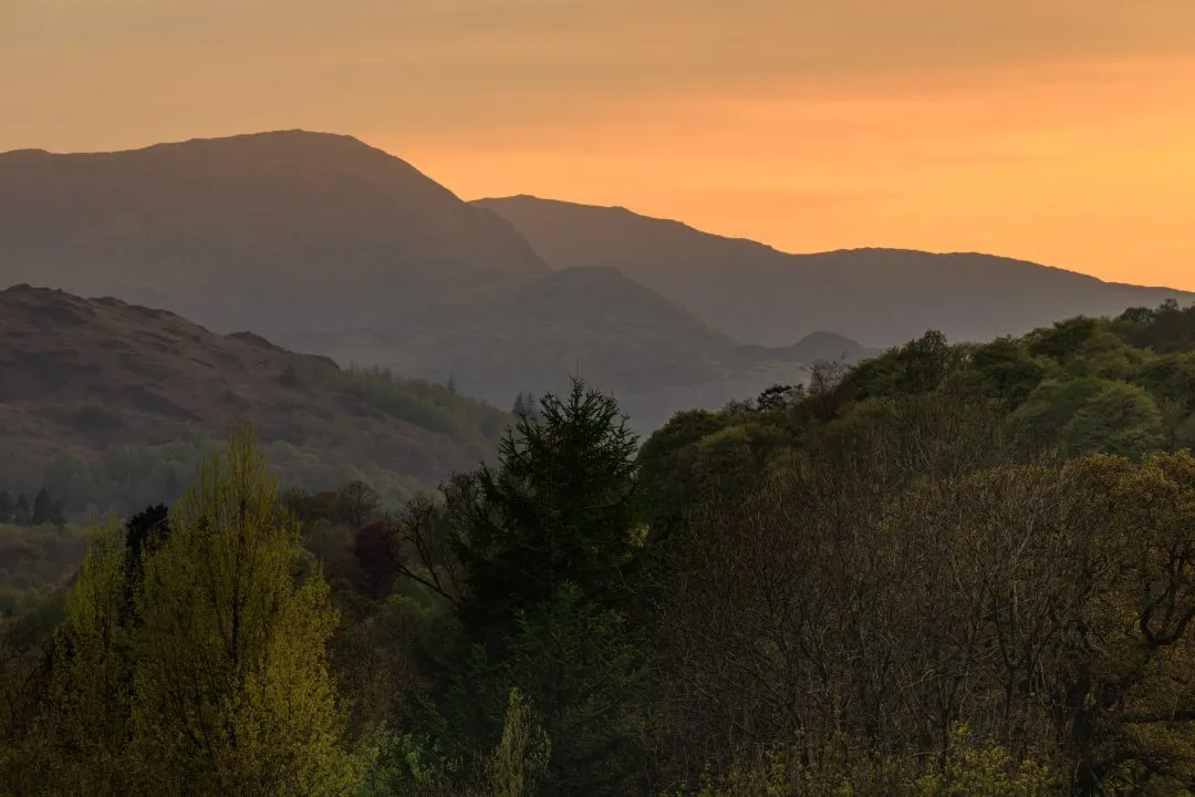 Hazy sunset mountain silhouettes, the Lake District, Cumbria