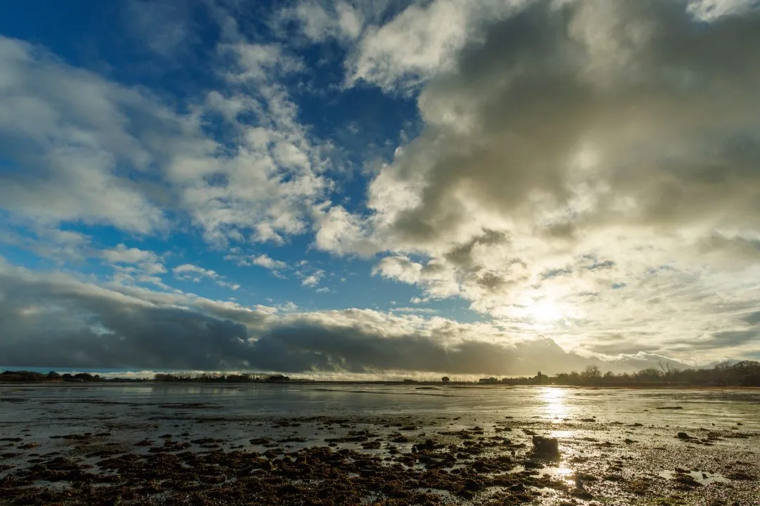 Langstone harbour sunburst storm clouds