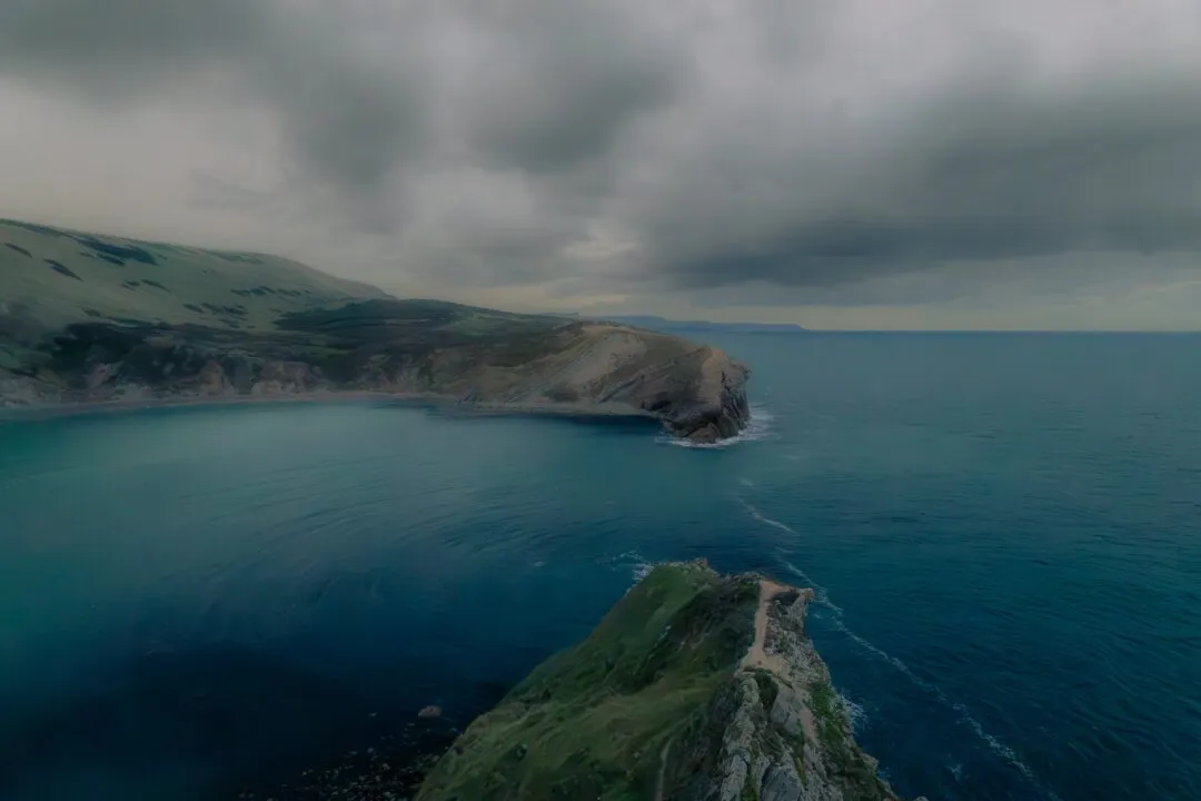 Lulworth cove aerial storm clouds