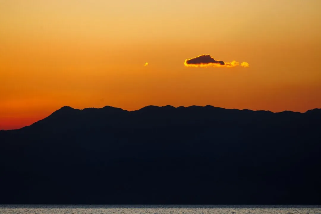 Minimalist mountain silhouette orange sky cebu