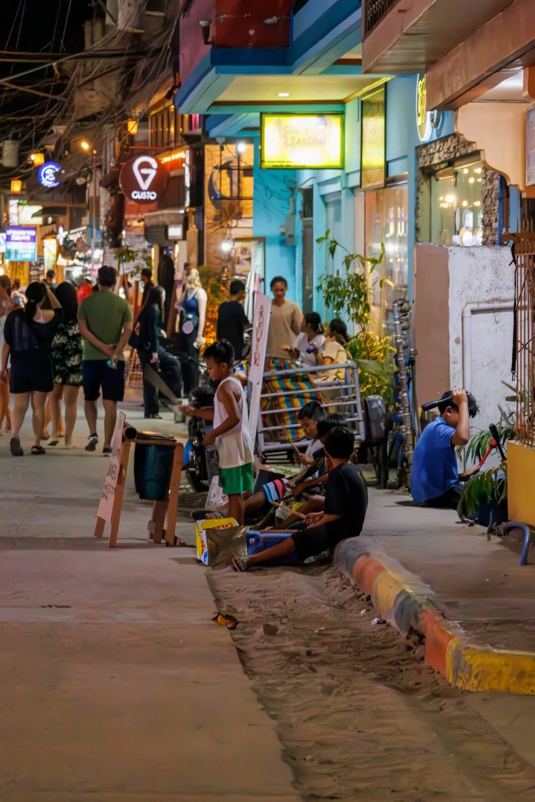 Night street buskers warm documentary El Nido