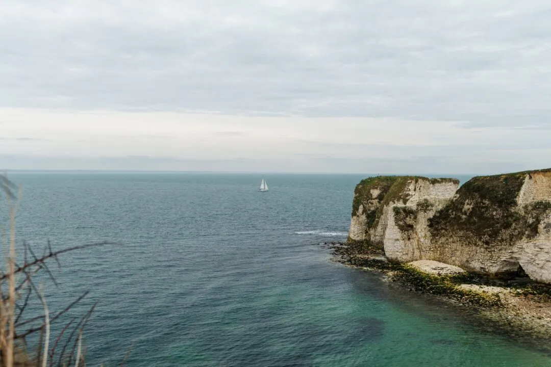 Old harry rocks cliffs sailboat