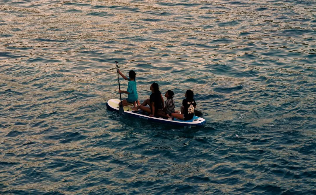 Paddleboard friends golden hour water siargao