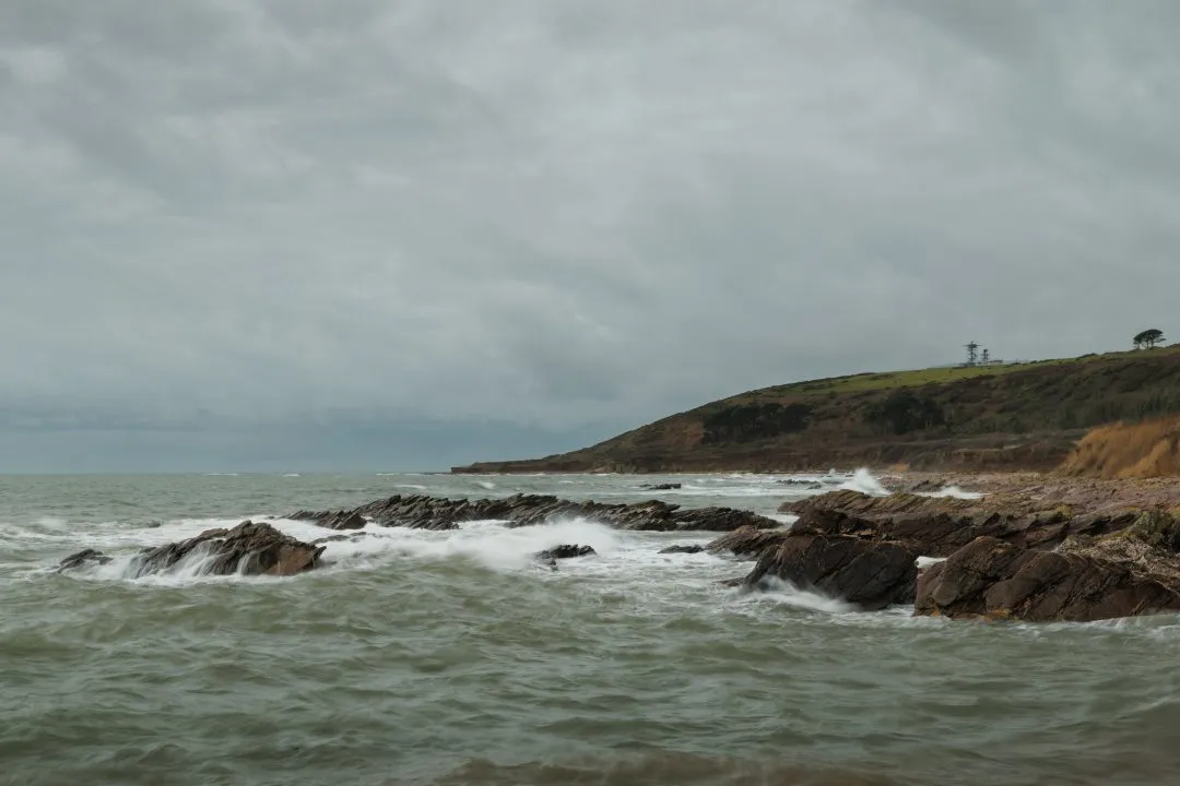 Rocky coastline with a distant headland, Wembury, Devon
