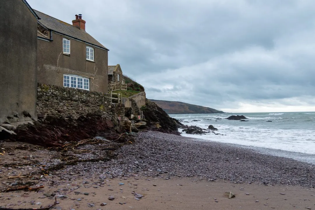 Stone cottage above a pebble beach, Wembury, Devon