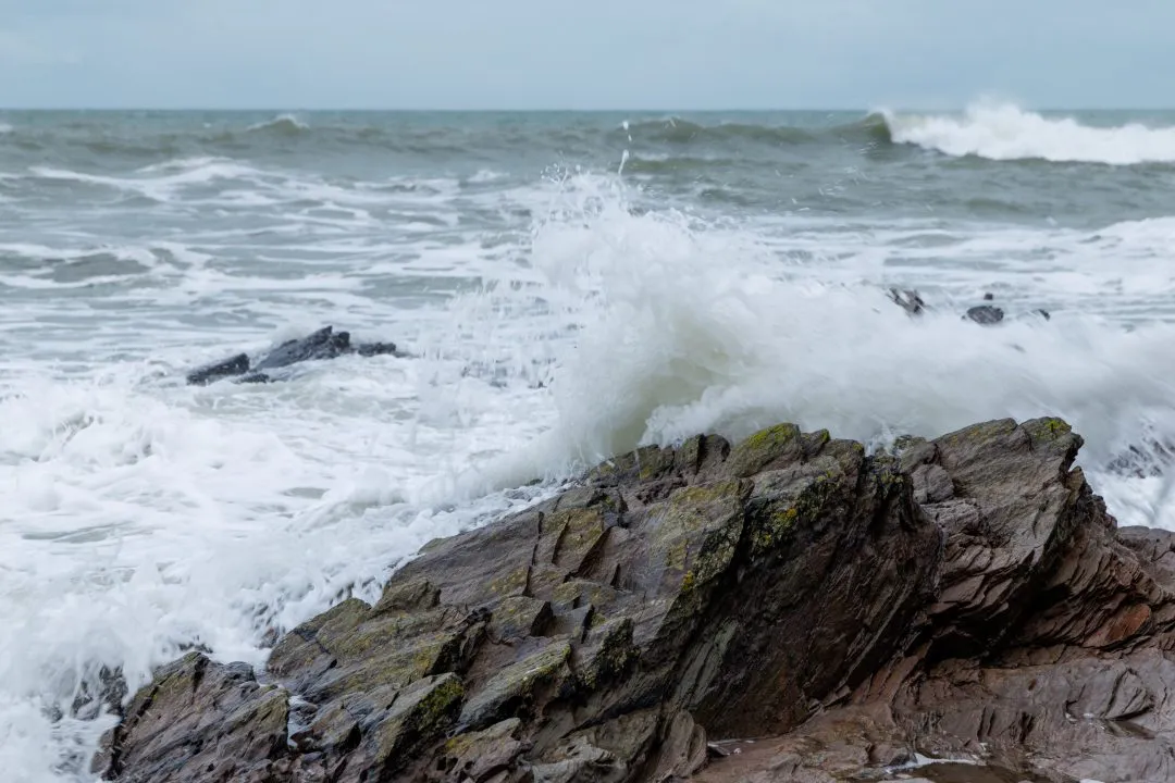 Wave crashing against a rock, Wembury, Devon