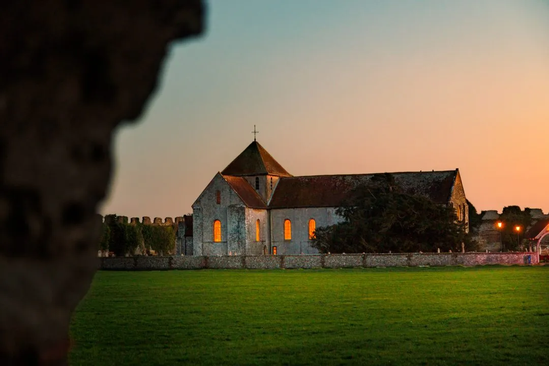 Castle church glowing windows dusk, Portchester