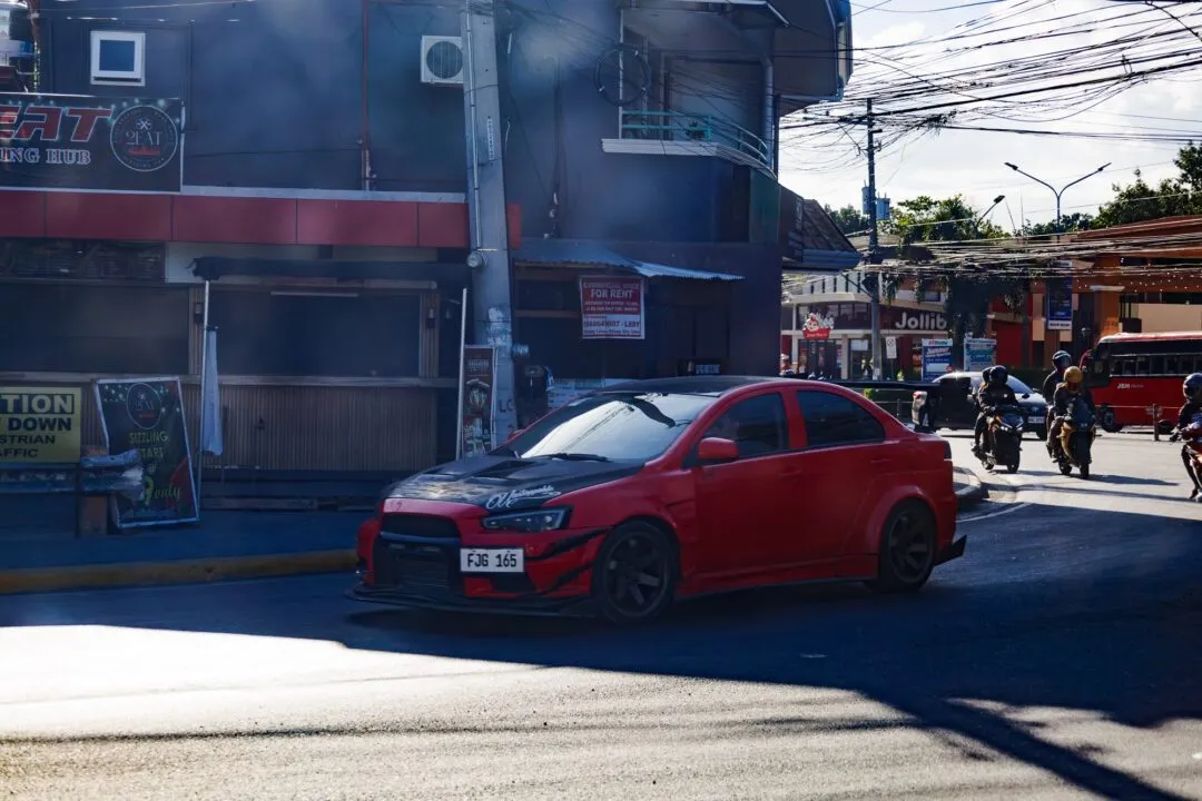 Red car street scene motion cebu