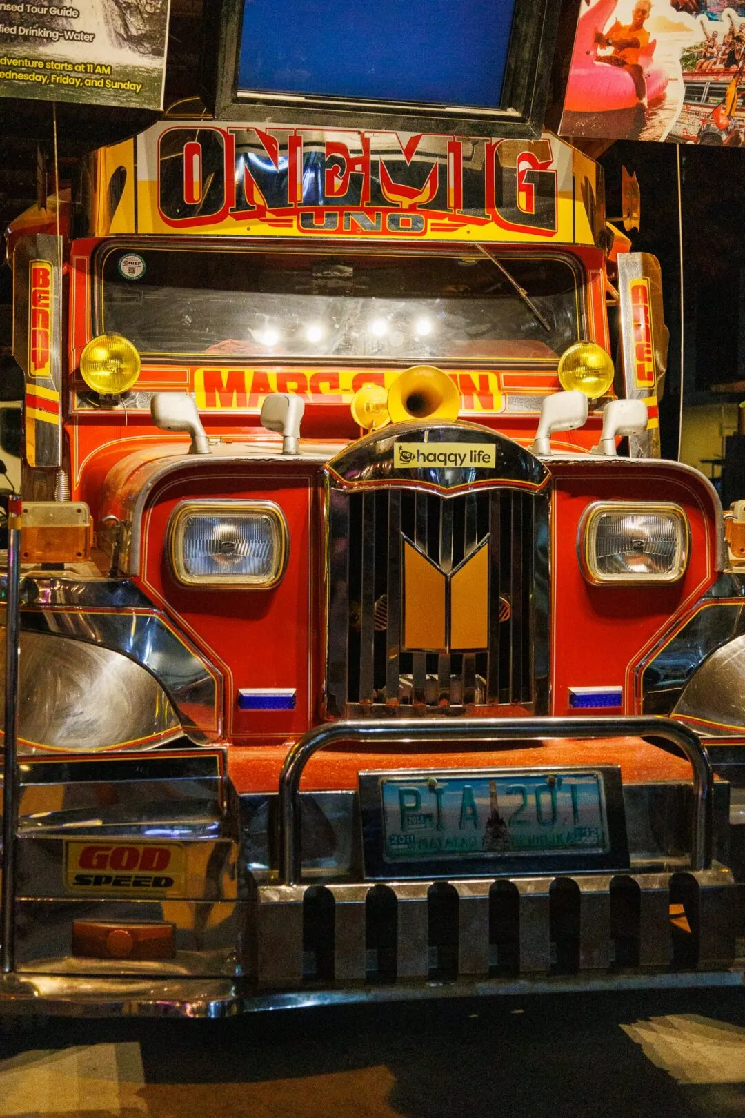 Red yellow jeepney grille close up night El Nido