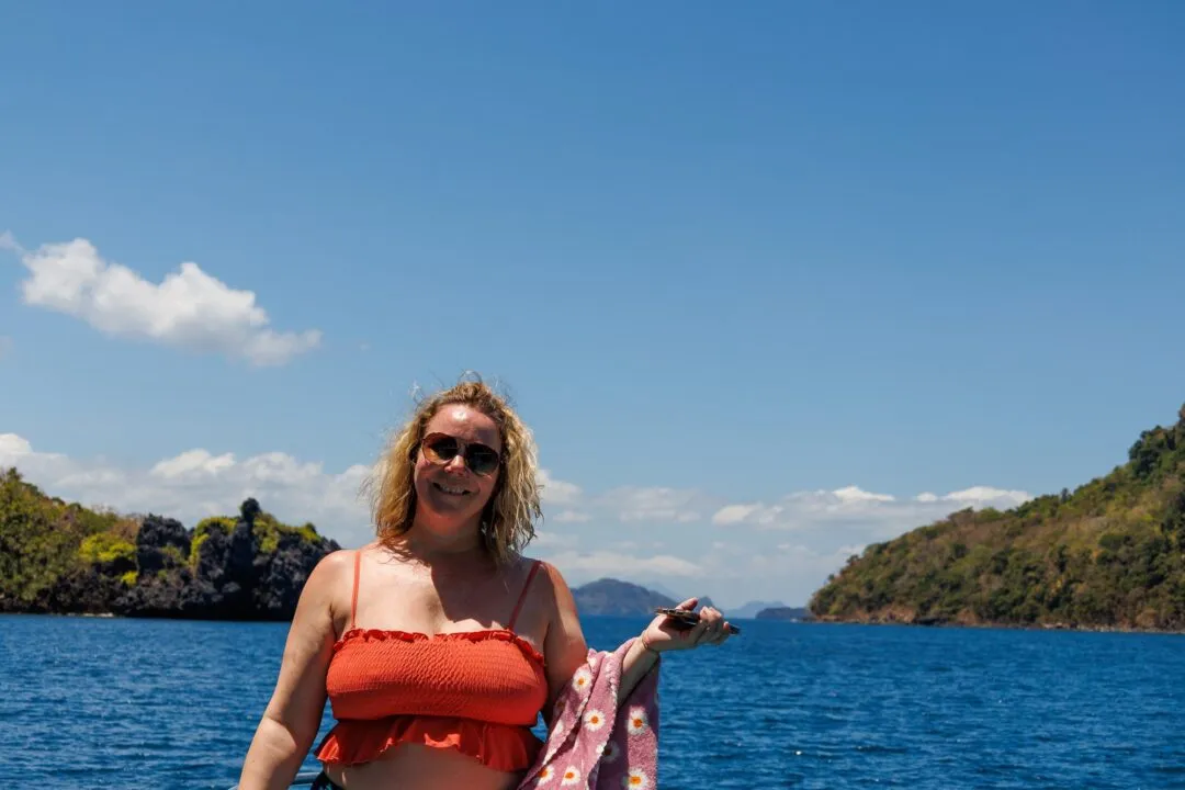 Smiling portrait turquoise karst backdrop El Nido