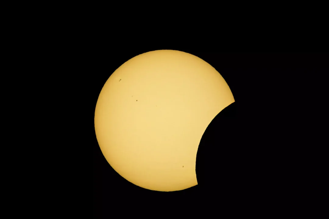 A deepening crescent of sunlight as the Moon covers more of the Sun's disc during the Ibiza partial solar eclipse