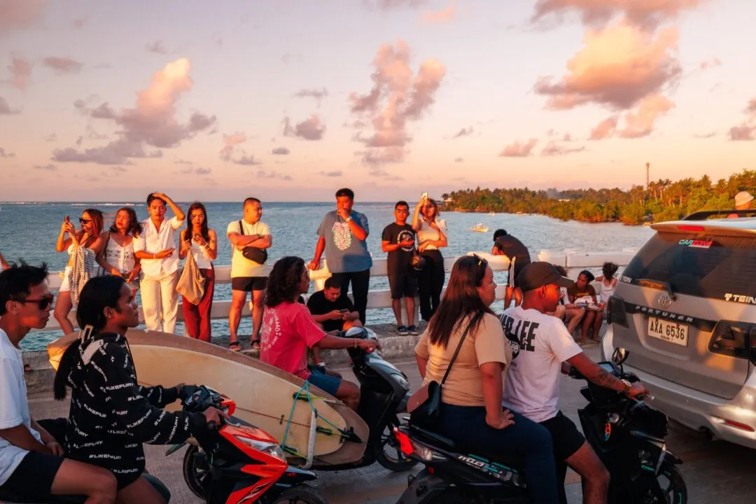 Surfboard crowd watching sunset siargao