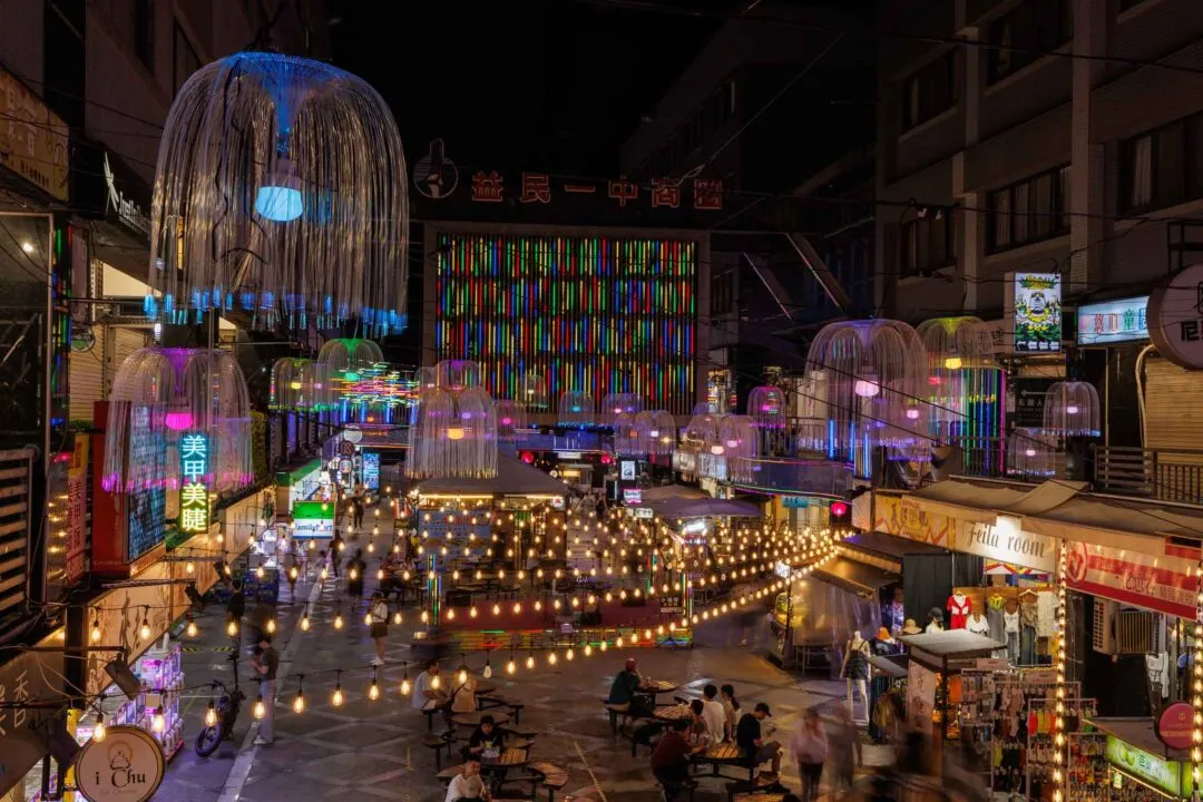 Night market street with jellyfish-style light installations and neon, Taichung, Taiwan