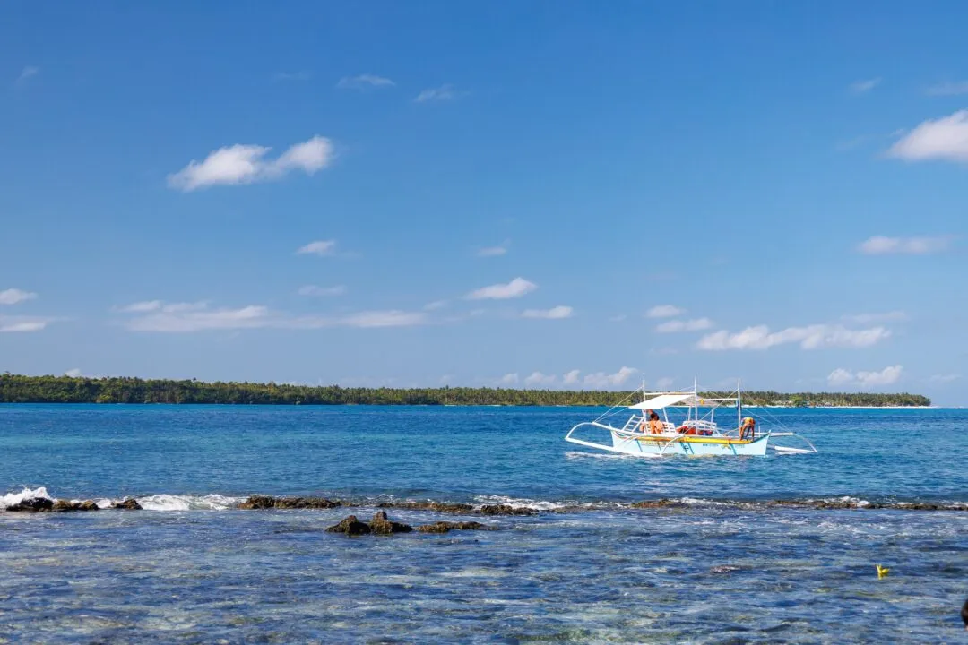 Tropical seascape bangka boat palm horizon siargao