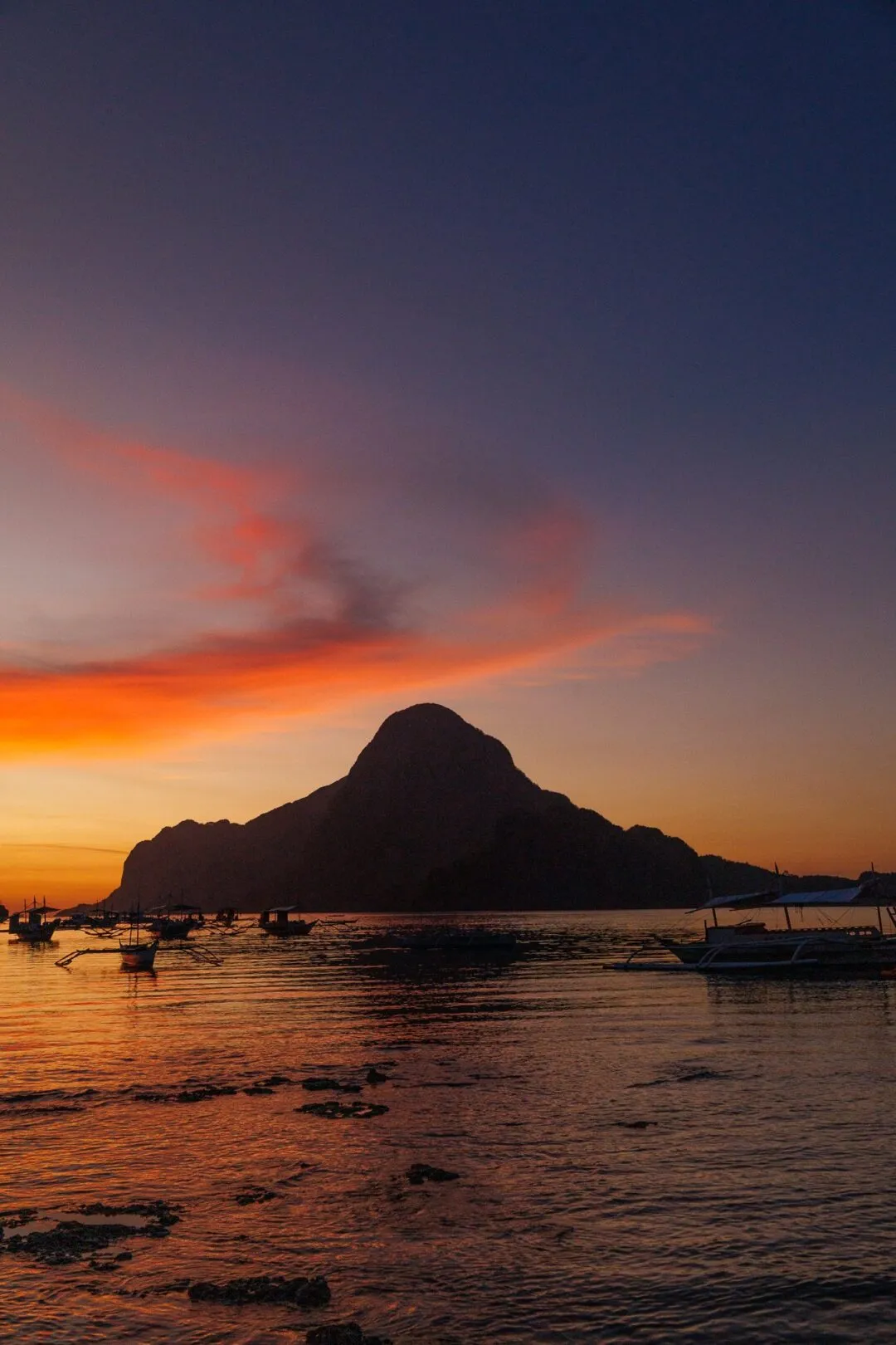 Vertical sunset bold mountain silhouette El Nido
